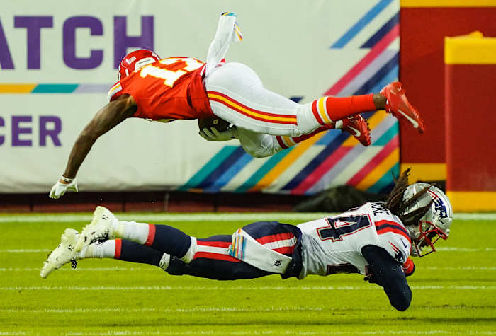 Oct 5, 2020; Kansas City, Missouri, USA; Kansas City Chiefs wide receiver Mecole Hardman (17) is tackled by New England Patriots cornerback Stephon Gilmore (24) at Arrowhead Stadium. Mandatory Credit: Jay Biggerstaff-USA TODAY Sports
